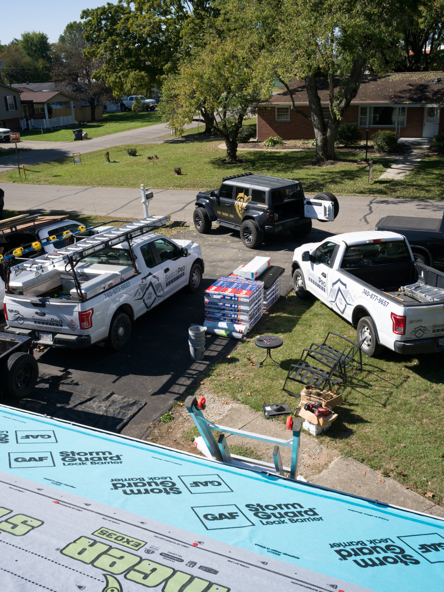 A ShieldPro Roofing job site seen from the roof